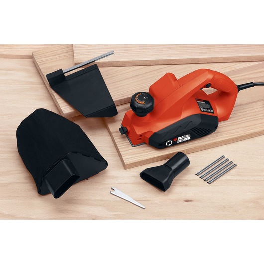 5 and 2 tenths Ampere 3 one quarter inch Planer with accessories placed on wooden planks.