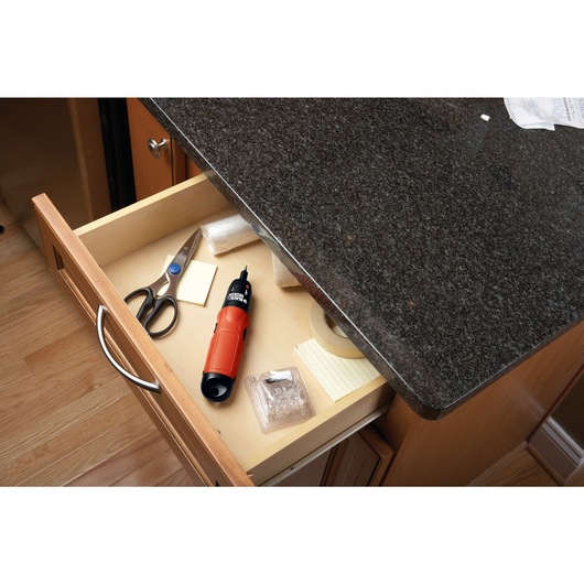 Cordless screwdriver in drawer.