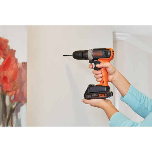 20 volt MAX Cordless Drill Driver being used by a person on a wall.