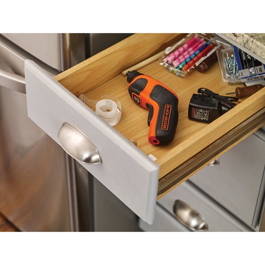 4 volt MAX Lithium Rechargeable Screwdriver placed inside a kitch drawer with other items.