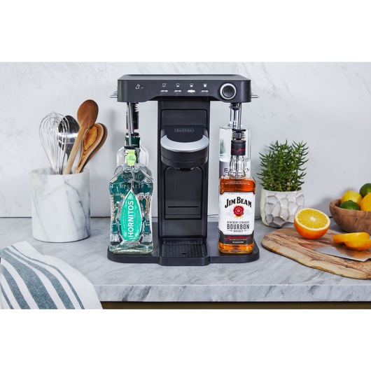 bev by BLACK+DECKER™ cocktail maker on a marble kitchen counter admist kitchen utensils and décor