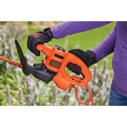 Built in T handle and full length trigger for control while cutting feature of 16 inch Electric Hedge Trimmer.