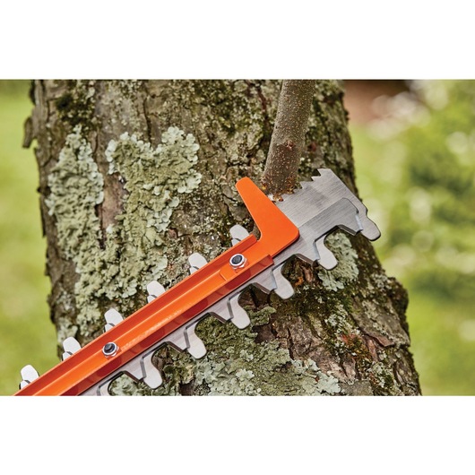 16 inch SAW BLADE Electric Hedge Trimmer being used to cut tree branch.