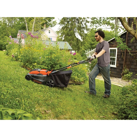 Lithium 16 inch Mower being used for mowing grass.