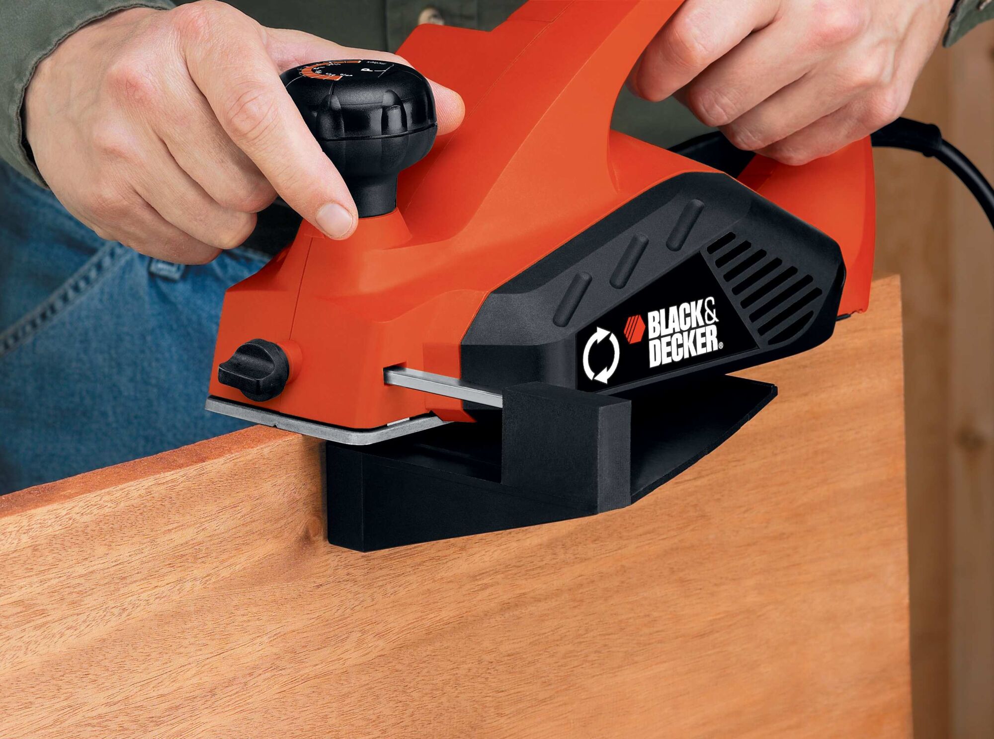 5.2 Ampere planer being used by a person to smooth out wooden edges.