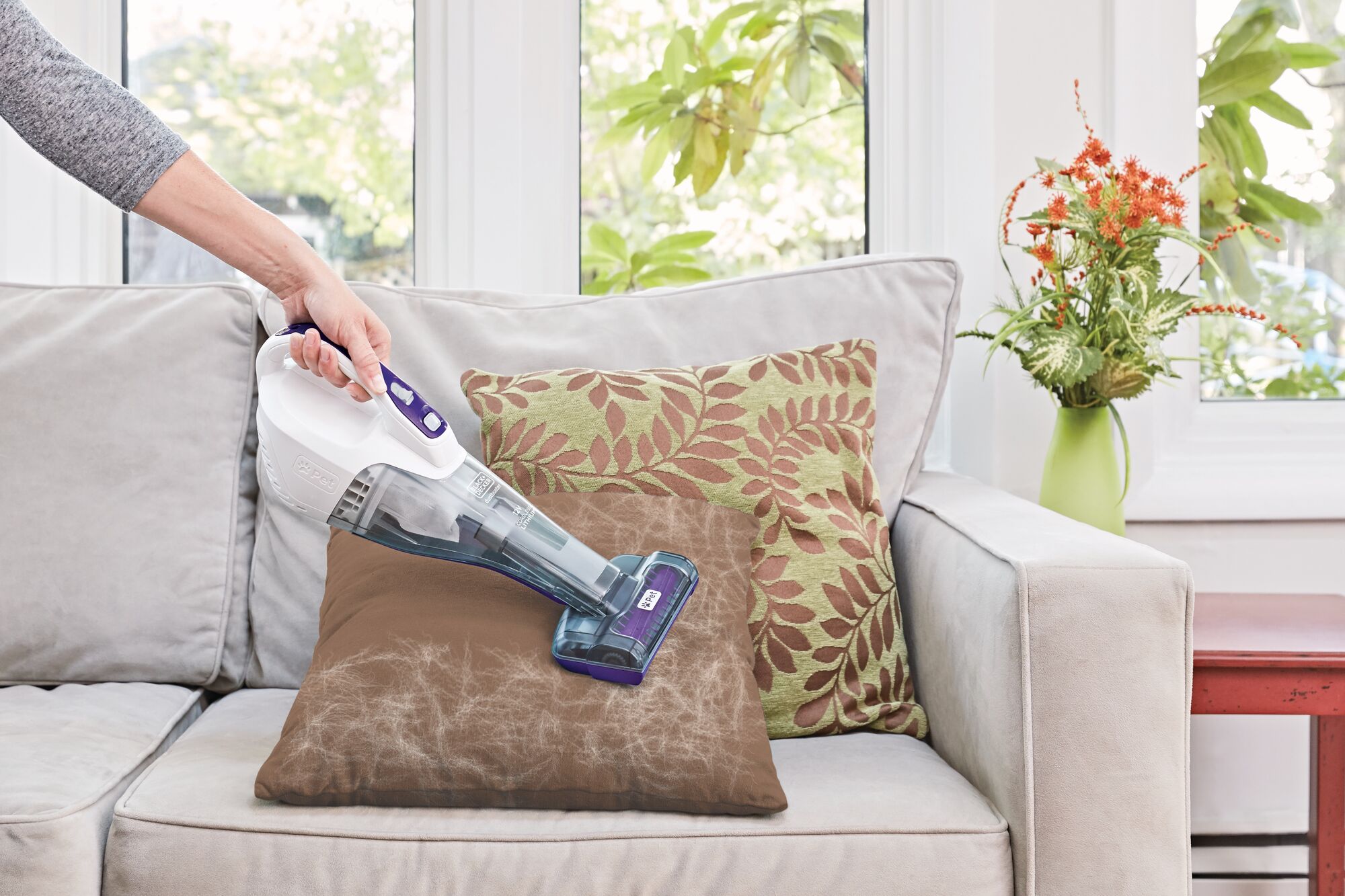 Profile of dustbuster quickclean cordless pet hand vacuum with motorized upholstery brush.