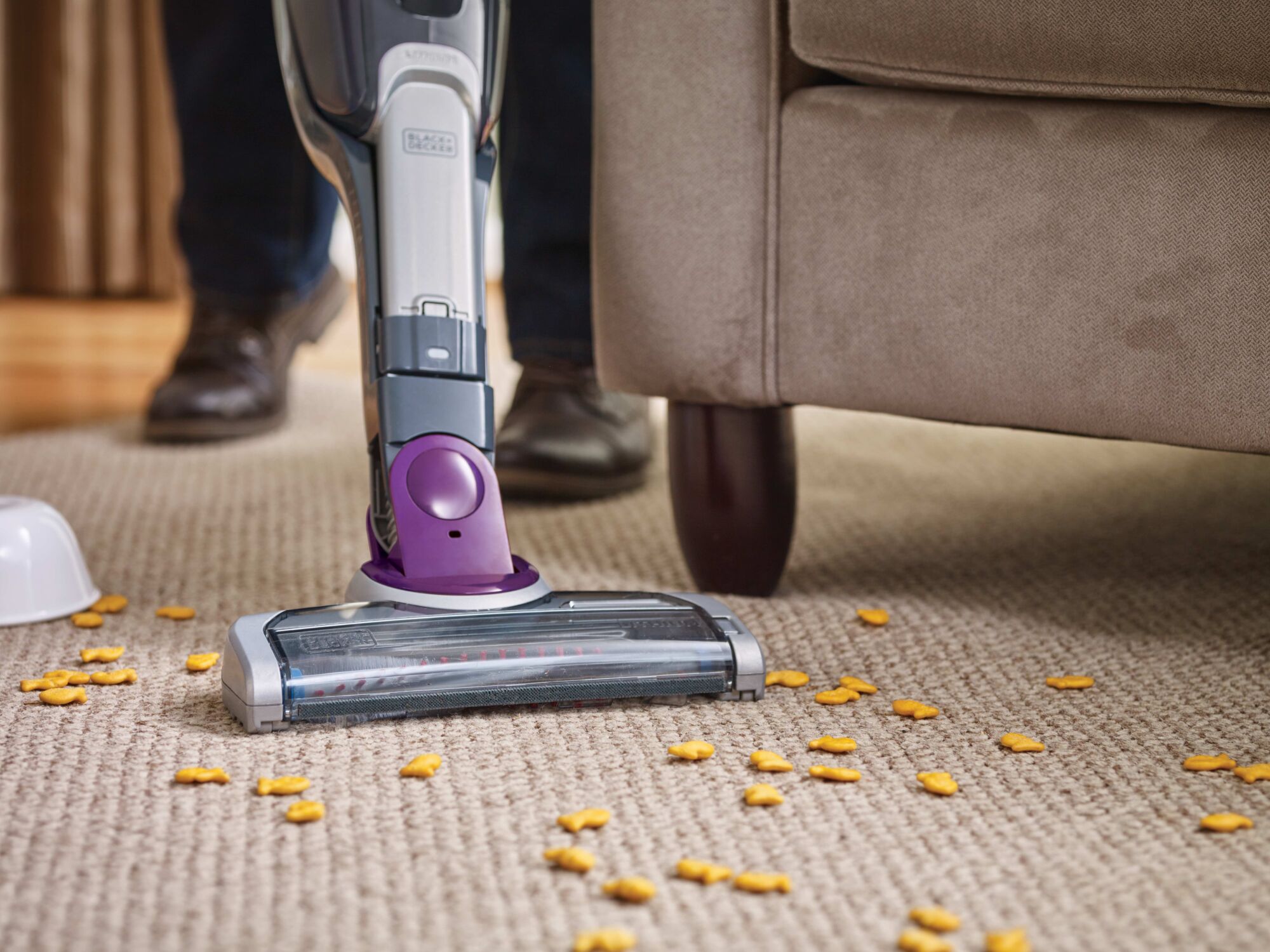 POWER SERIES 2 in 1 cordless stick vacuum being used to clean a carpet.